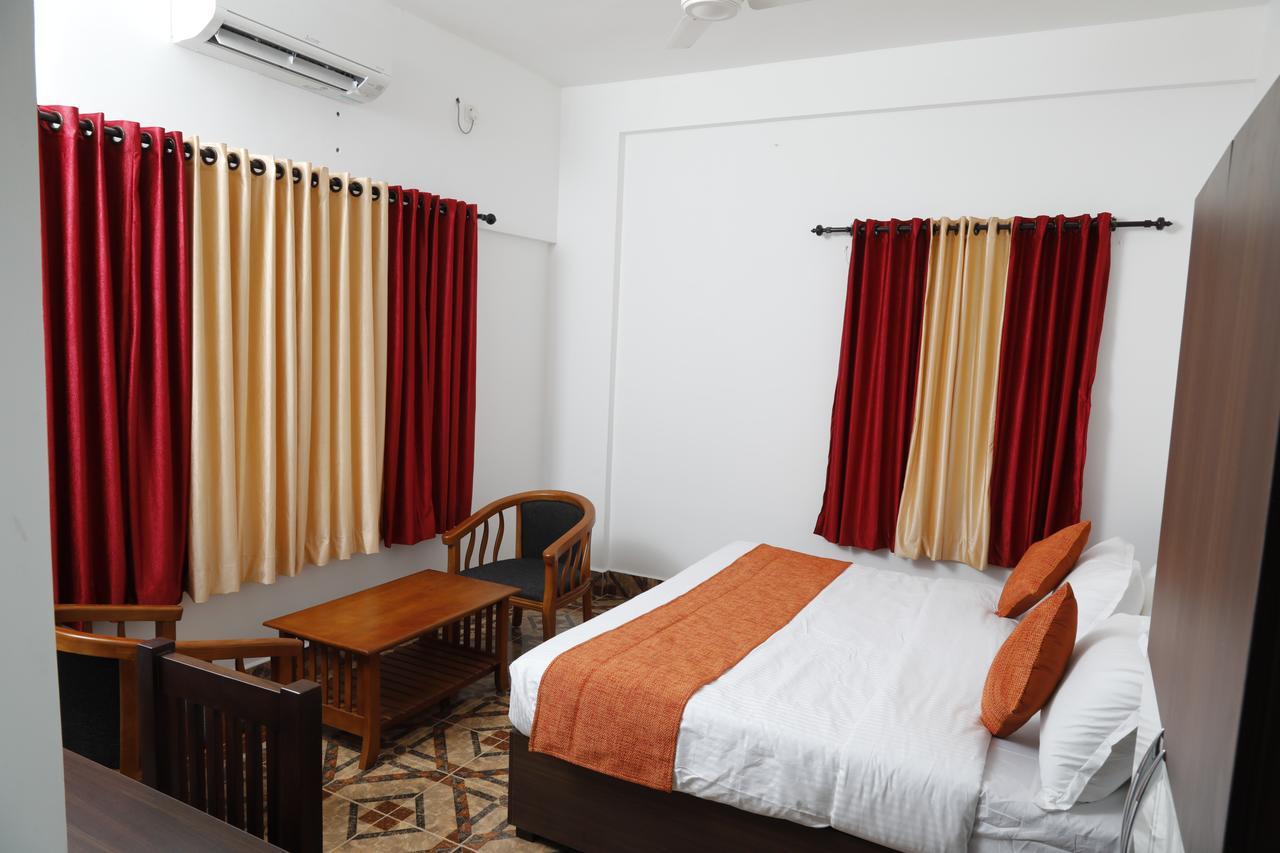 Puthens Clifton Inn Kottayam Bagian luar foto